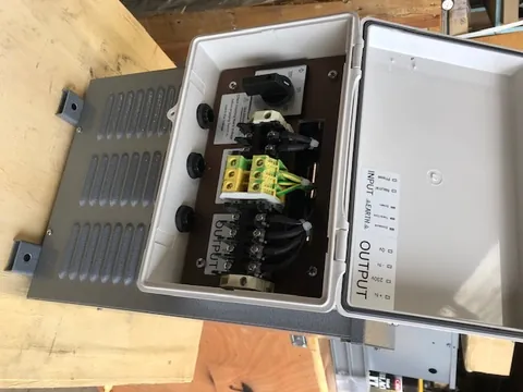 Enclosure with a selector switch and multi-tap output terminals