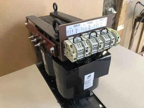 Large three-phase open-frame transformer with a lifting eye