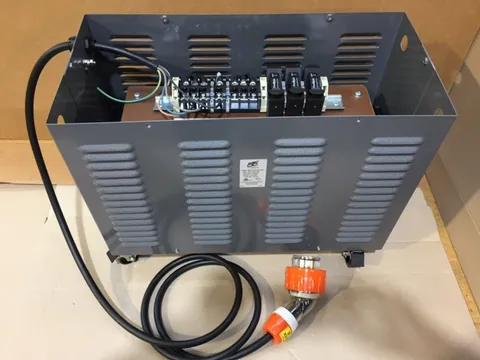Enclosed unit with a lead and an orange three-phase plug