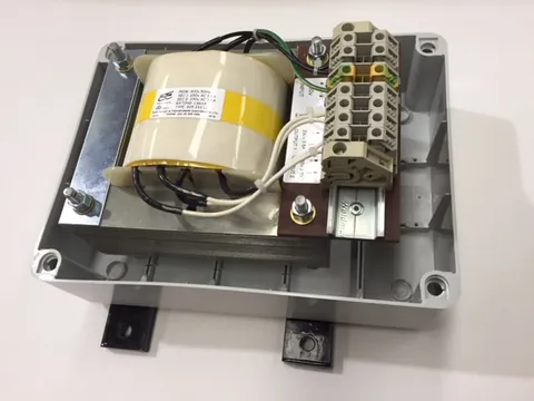 Toroidal transformer in an IP enclosure with two outputs