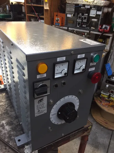 Variac test cabinet with volt and amp meters, a dial and lamps